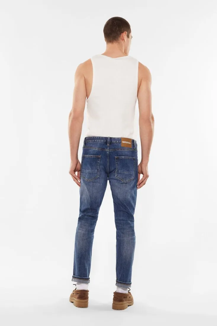 Jeans slim-fit effetto délavé con abrasioni