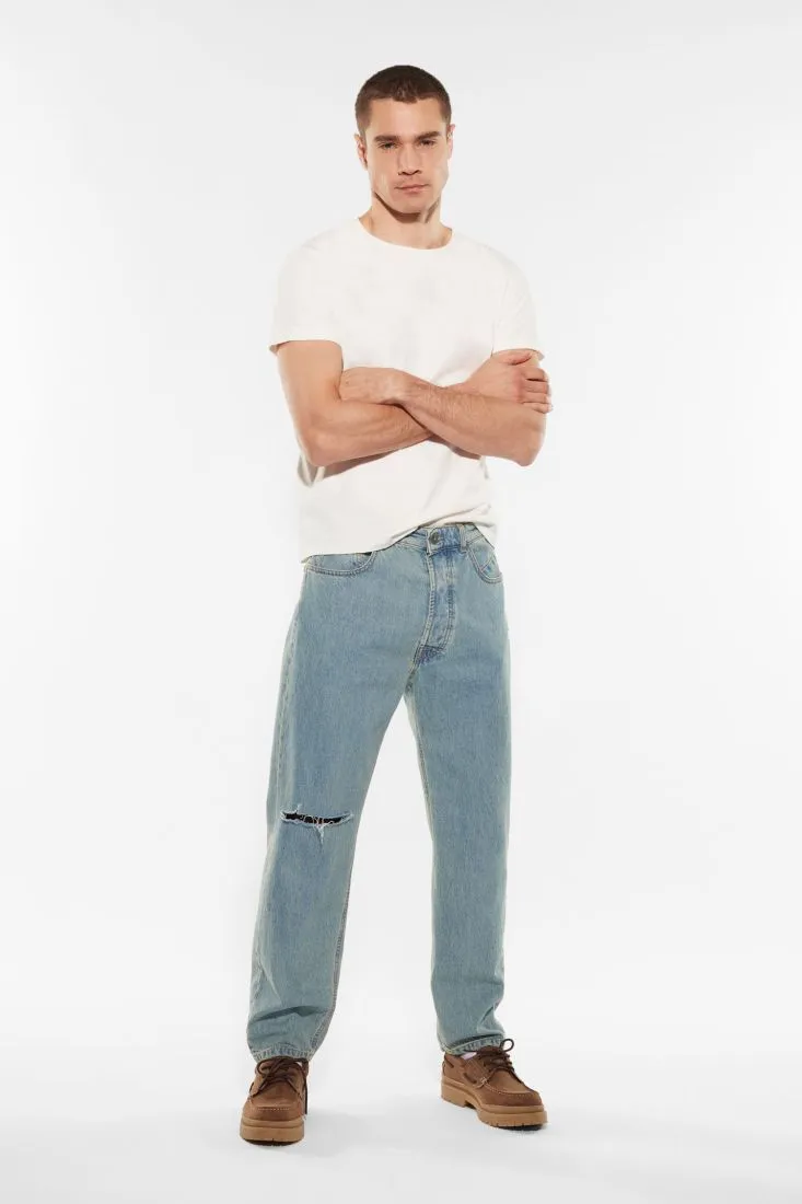 Jeans slim-fit in puro cotone con abrasioni