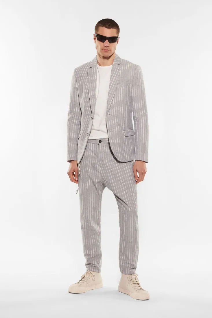 Pantaloni slim-fit fantasia gessata con catena